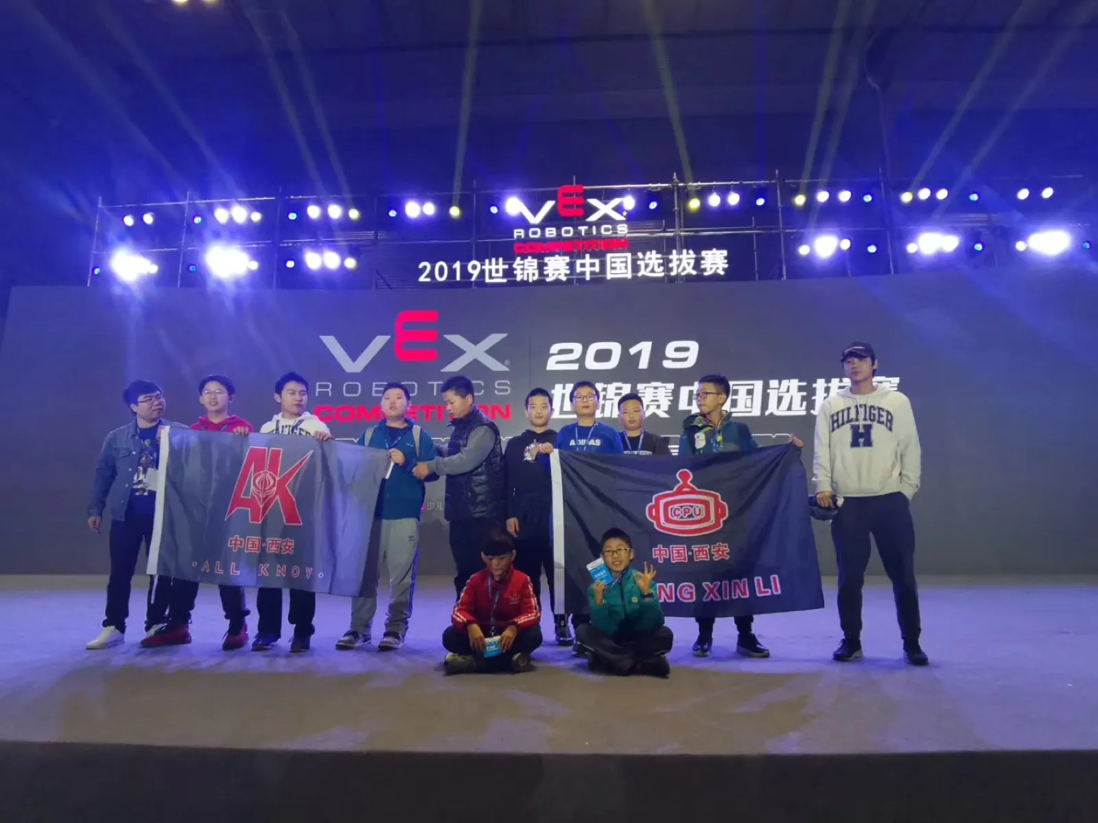 The AK Robotics team celebrating on the championship stage