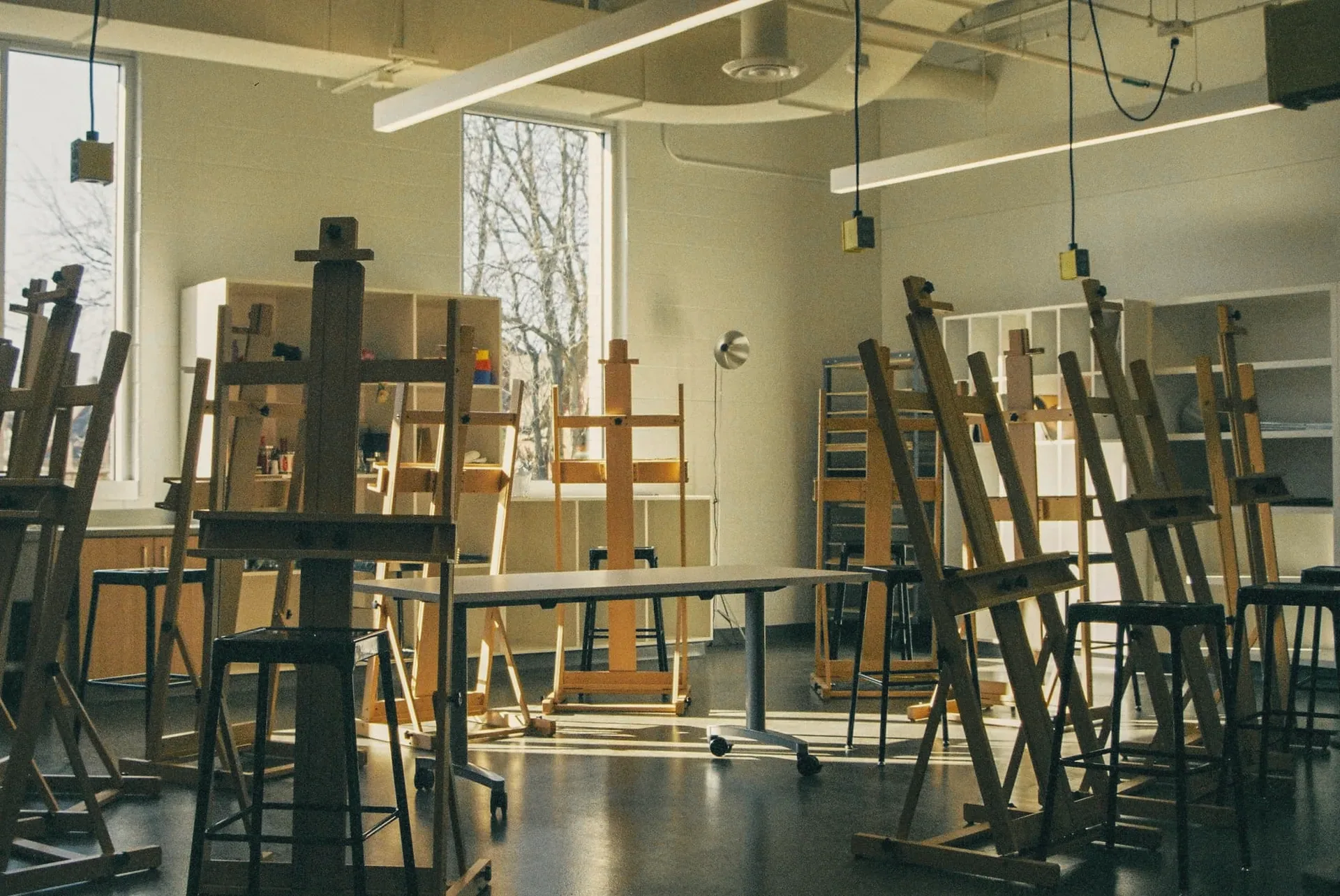A sunlit studio full of easels