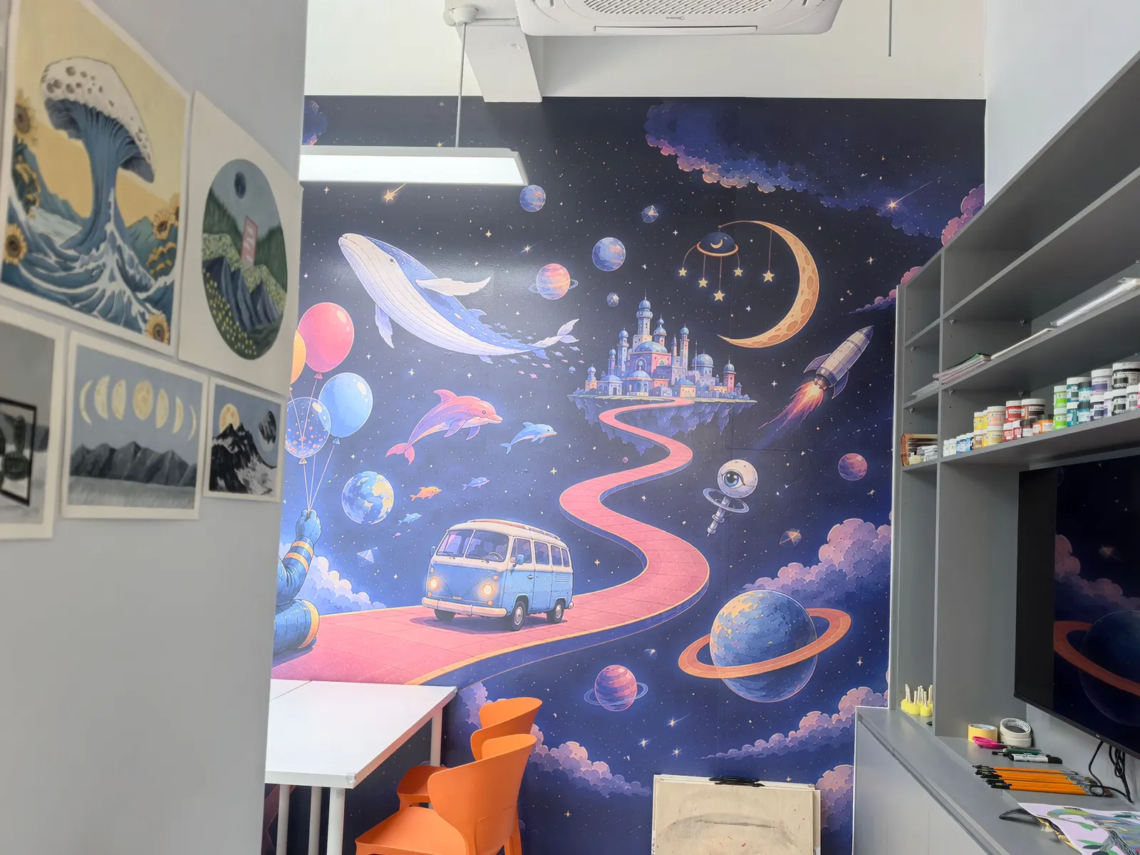 The space-mural studio and its materials shelf