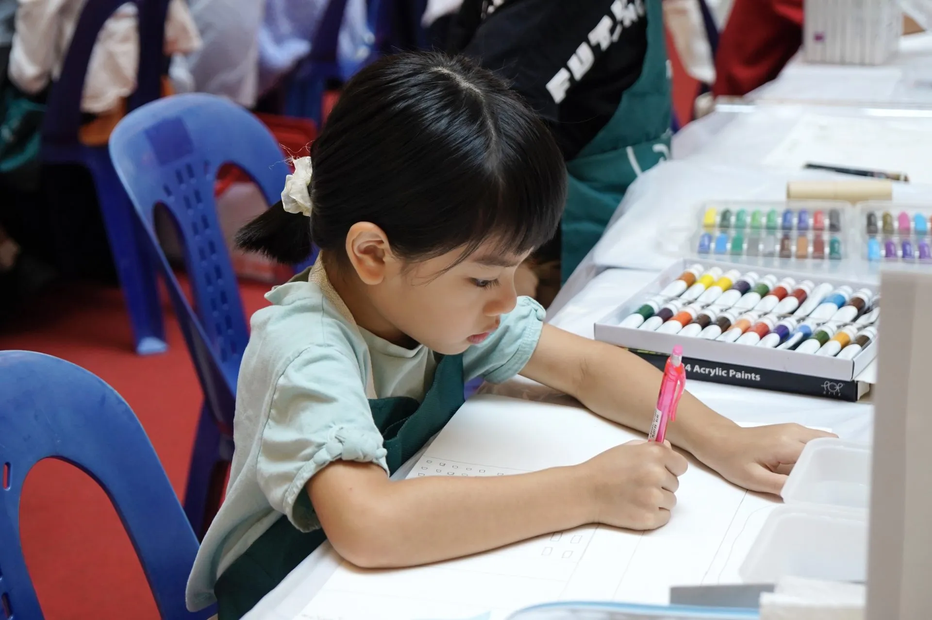 A warmly lit OpenKids classroom in session