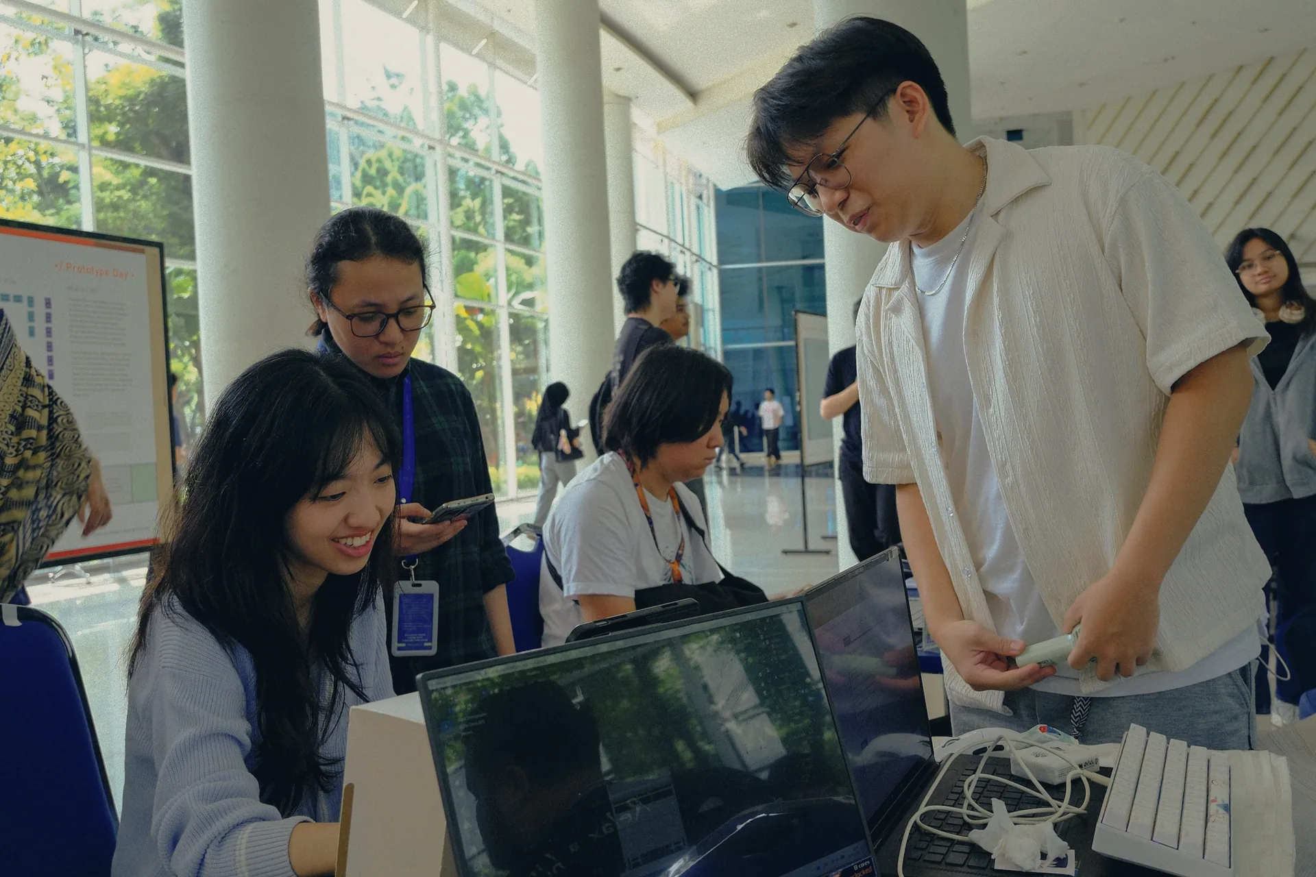 Young people trying out projects at a technology exhibition