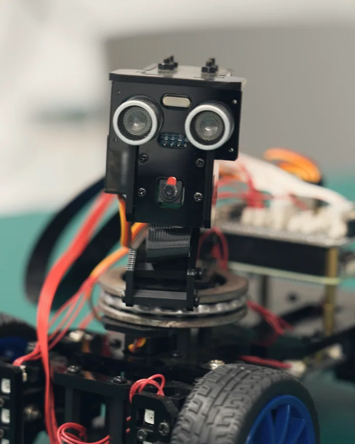 A small robot car with an ultrasonic sensor up close
