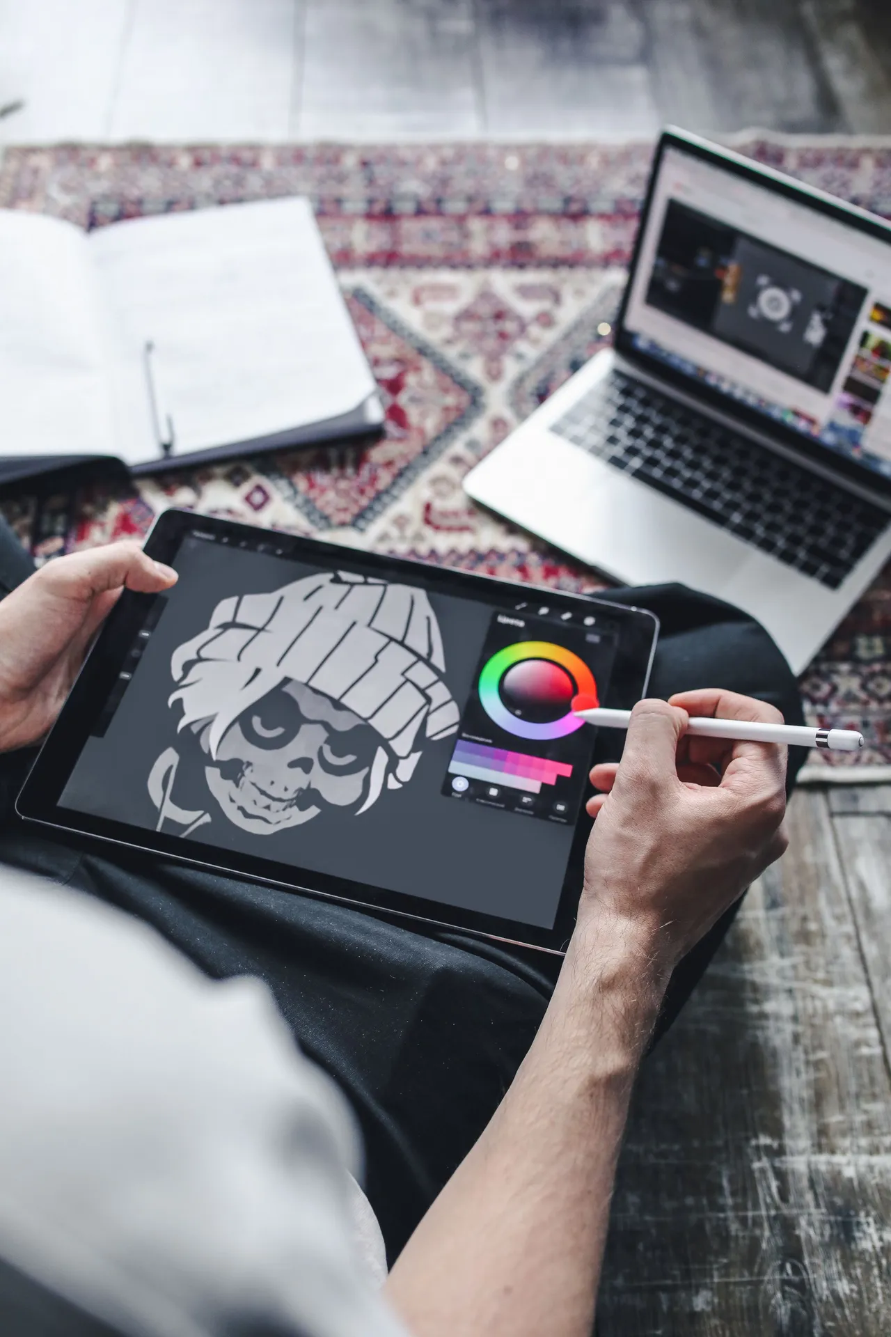 A student refining a digital illustration on a tablet