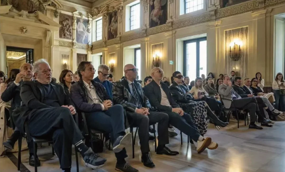 A cultural gathering in a historic Italian interior · Source article image